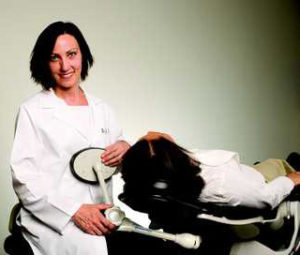 dentist in chair with patient