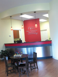 Fresh and bright, the reception area creates a great first impression. The stainless steel and glass tiles were used on the reception desk for easy cleanup.