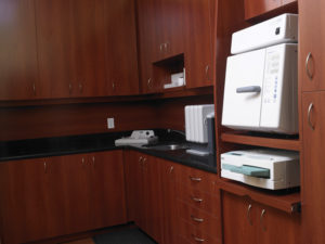 Quartz countertops make for easy upkeep in the Sterilization Rooms. Tall cabinets provide for increased storage space. Equipped with the SciCan Statim 2000 and KaVo QUATTROcare