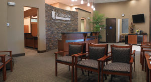 Comfortable chairs and a patient beverage station make the waiting room an inviting space.