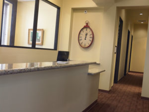The sunlight-filled office, with its soothing wall colors, transitions from tile floors in the reception area that look like wood to russet-colored carpeting in the hallways. A separate check-out area gives patients more privacy when talking about treatment, insurance information or payments.