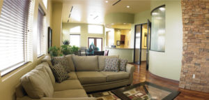 Casual elegance describes the office theme, and that is especially evident as patients sink into the large sectional couch or read or work at the round table that overlooks Dr. Cumberbatch's original art.