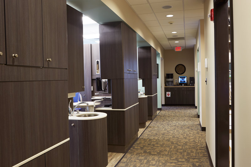 The office has seven potential treatment rooms, with five fully equipped today with side and 12 o-clock cabinets and chairs. At the end of the hall is a centrally located image processing alcove.