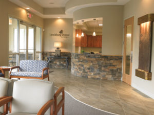 Stacked stone accents, 15-foot ceilings and a beautifully cascading water feature work together to create a welcoming and warm entrance to the practice.
