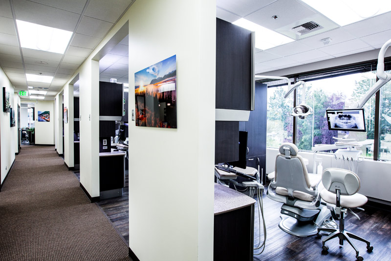 Carpeted hallways and nature photography that lines the walls lead patients to the nine sunlit open-bay operatories.